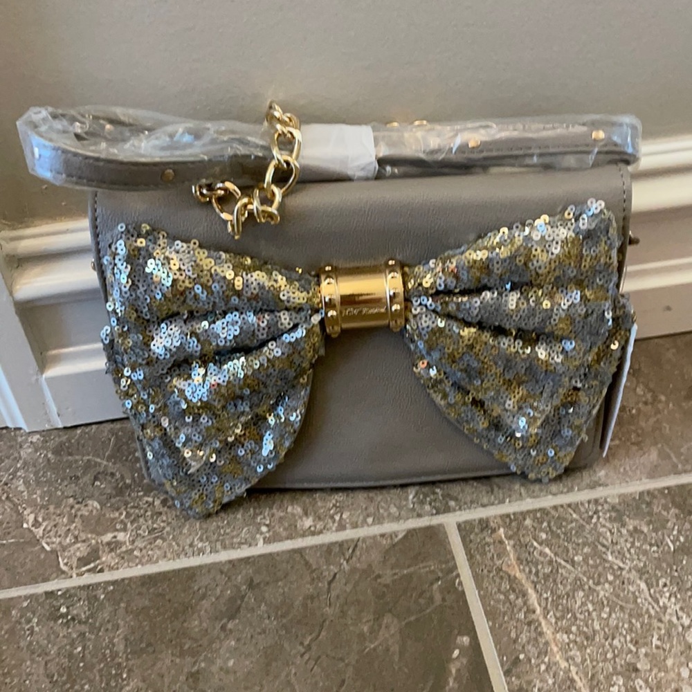 Fun, new Betsey Johnson handbag with silver sequined bow and gold chain.